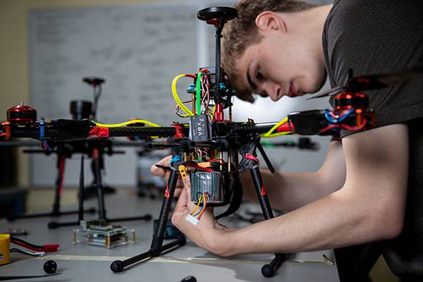 Student working on drone electronics