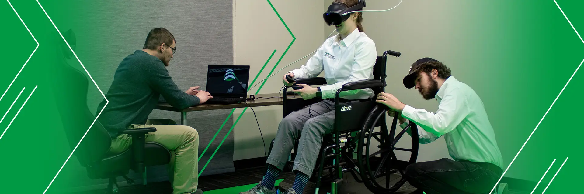a person in a wheelchair uses virtual reality as they are monitored by two researchers