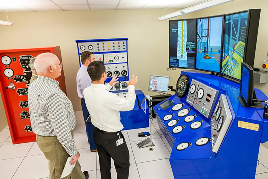 a group of men look at drilling lab equipment