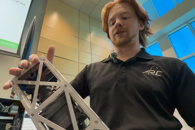 a student shows a rocket