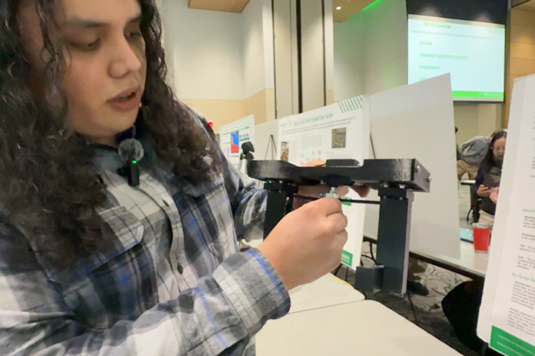 a student shows a drone