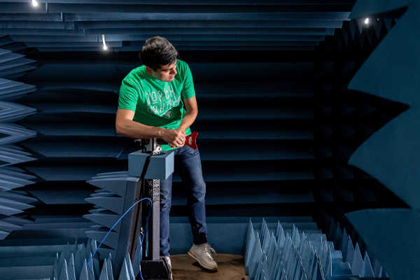 a student working on satellite equipment