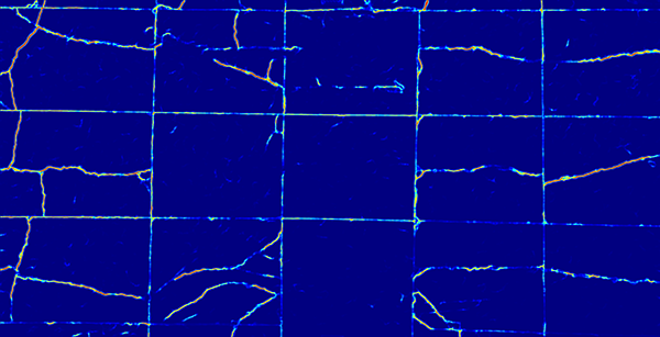 Heat map of the same concrete surface rendered on a dark blue background. Crack paths and panel joints appear as bright cyan, green, and orange lines indicating high model confidence, with the intact concrete showing as uniform dark blue.